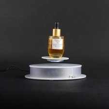 Rotating base for object levitation