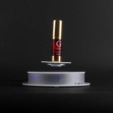 Rotating base for object levitation