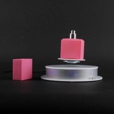 Rotating base for object levitation