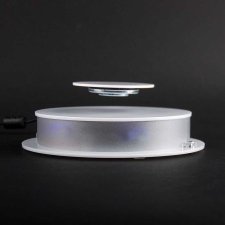 Rotating base for object levitation